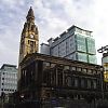 greek-architecture inspired church in front of 70s-style buildings