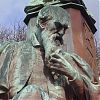 Statue showing bearded man thinking