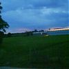 A green house behind the camping site, luminating A green house behind the camping site, luminating